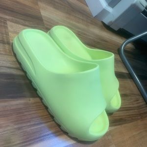 Glow green Yeezy slides